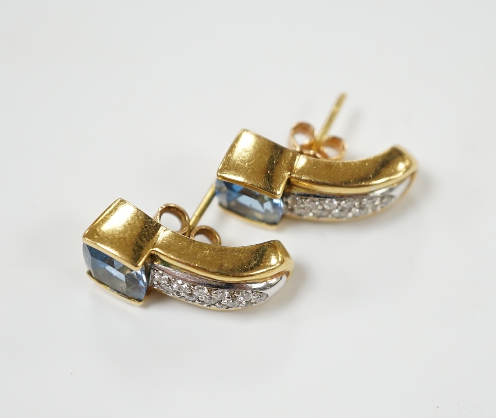 A modern pair of yellow metal and single stone fancy cut aquamarine and diamond chip cluster set earrings, 17mm, gross weight 10.6 rams. Condition - good
